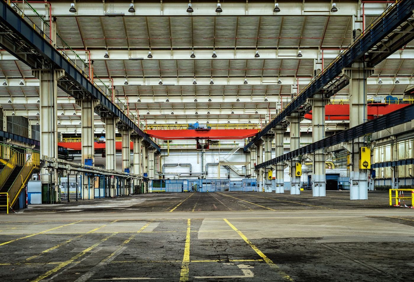 Industrial plant floor with overhead crane rails
