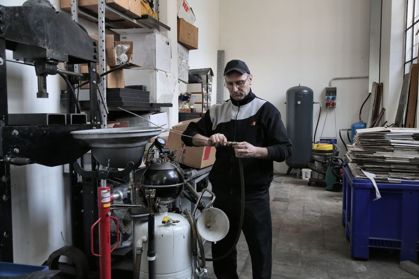 Field technician with a full workshop toolkit ready for machine service